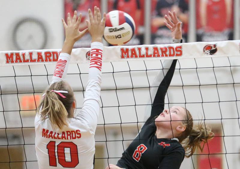 Henry-Senachwine's Rachel Eckert and Woodland's Grace Longmire go face to face at the net on Thursday, Oct. 3, 2024 at Henry-Senachwine High School.