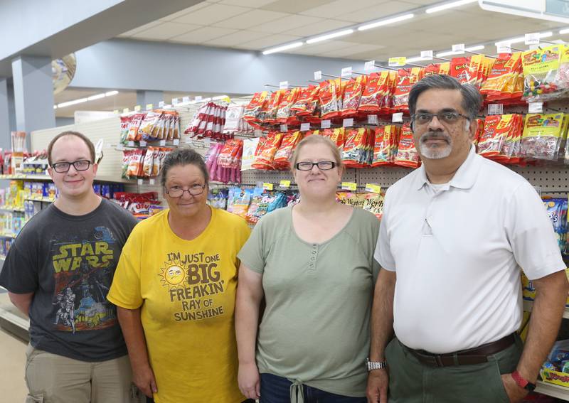 Illinois Valley Food and Deli employees (from left) Jack Reppin, Debbie Martinez, Jacki Caputo and manager Nick Tharani pose for a photo on Friday, Aug. 16, 2024 in La Salle. The store will open on Monday August 19 at 7a.m. The store has been closed since February.