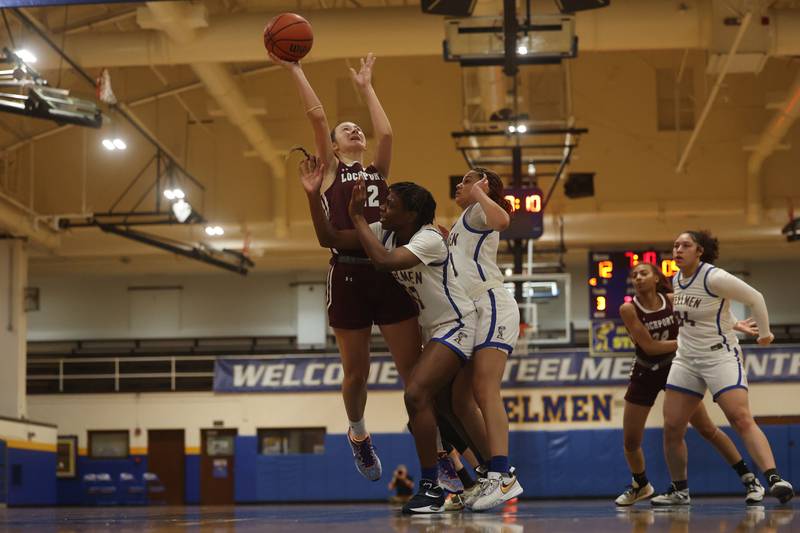 Lockport’s Kara Osinski puts up a shot against Joliet Central.
