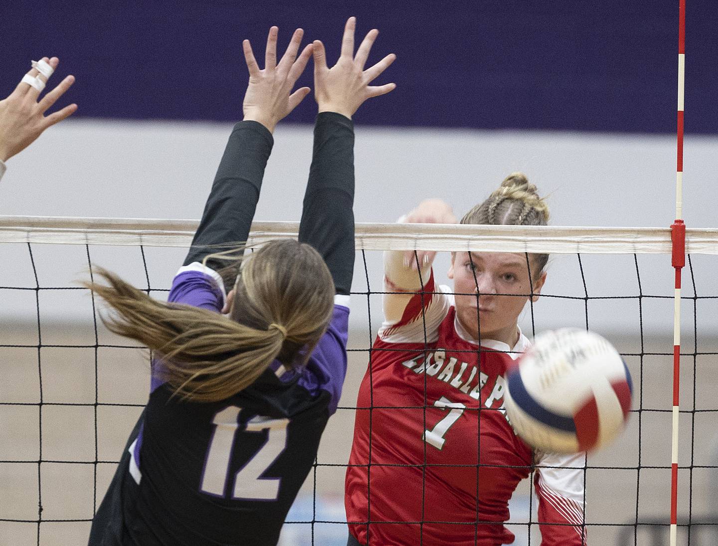 LaSalle-Peru’s Aubrey Duttlinger hammers a shot against Dixon’s Izzy Queckboerner Wednesday, Sept. 10, 2025.