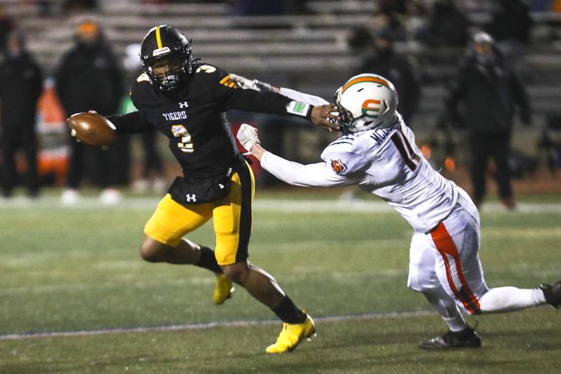 Joliet West quarterback Skyar Crudup scrambles out of the backfield on Friday, April 2, 2021, at Joliet West High School in Joliet, Ill.