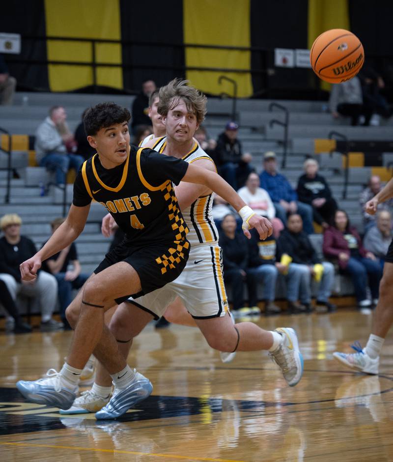 Reed-Custer's Chase Isaac, left, and Herscher's Dylan Bright, right, look to control a loose ball in a game on Wednesday, November 26, 2025.