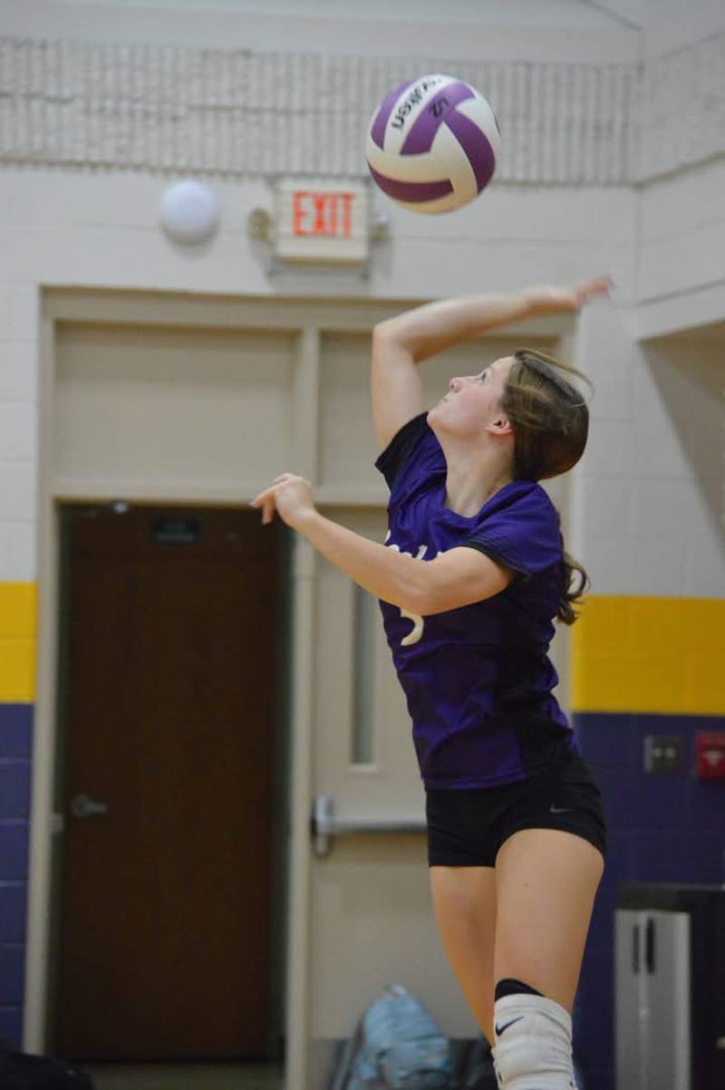 Rochelle's Tinley Tabor serves the ball during an eighth-grade volleyball match. Tabor served nine straight points in the match.