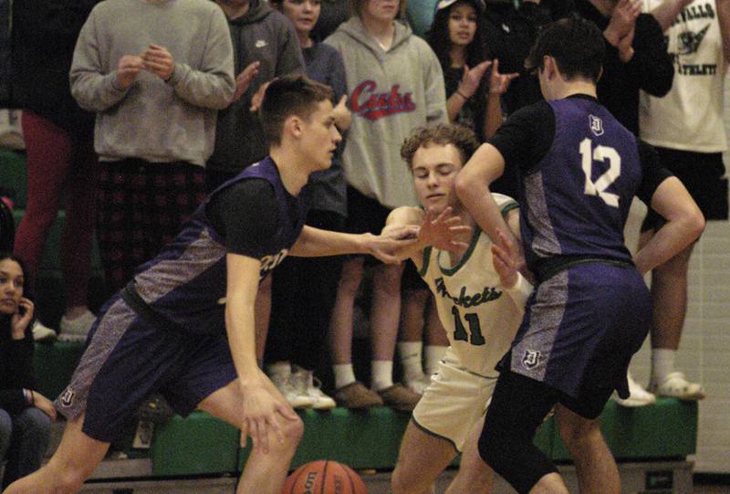Rock Falls' Gavin Sands applies pressure to Dixon's Cullen Shaner during their game Tuesday, Feb. 6, 2024, at Rock Falls High School.