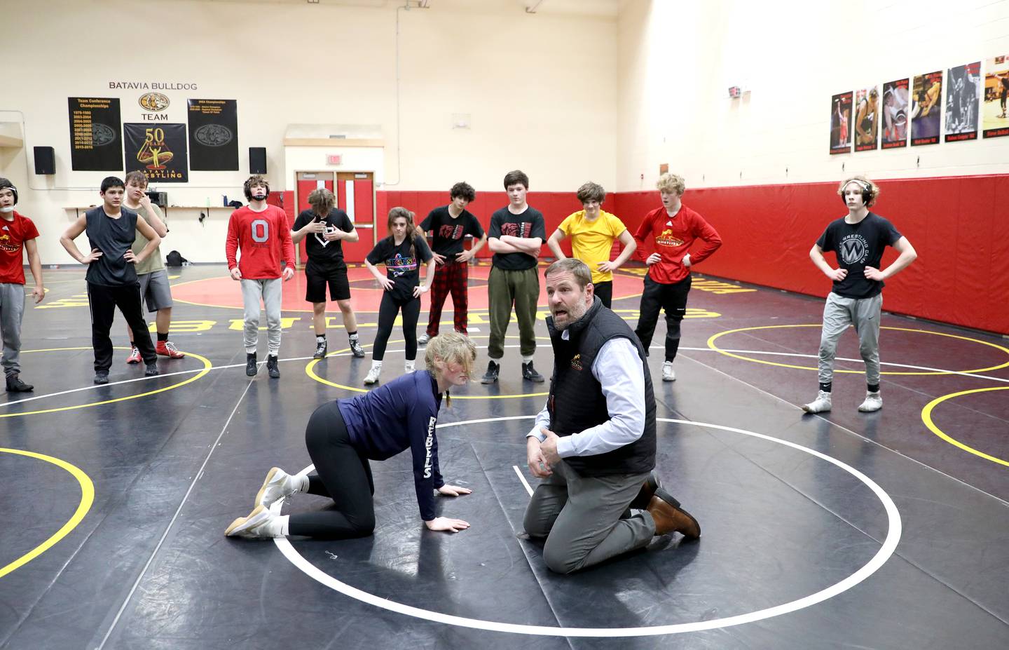 Batavia High School social studies teacher Scott Bayer during a recent class. Bayer is also the head coach of the school’s girls wrestling team.