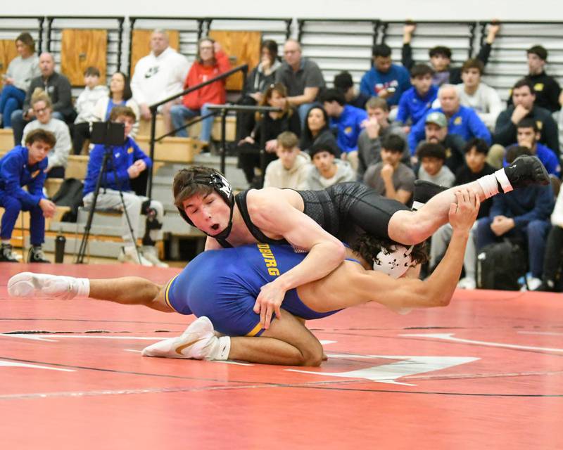 Zach Steward of Marmion Academy, right, stays out of the hands of Brady Ritter of Sandbur during the regional meet in the 144-weight class on Feb. 25, 2025, held at Yorkville High School.