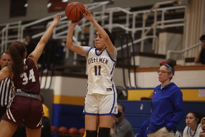 Joliet Central’s Isabel Sanchez makes an eyes closed three point shot against Lockport.