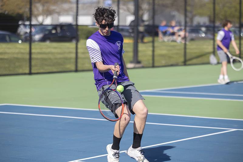 Dixon’s Damien Beck returns a shot to Sterling’s Brecken Peterson during a tennis match Thursday, May 4, 2023.