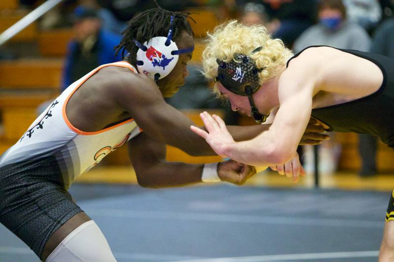 St. Charles East's Elijah Chiaro wrestles Glenbard North's Cody Detz in the 170-pound championship round at the DuKane Conference at Glenbard North on Jan. 29, 2022 in Carol Stream.