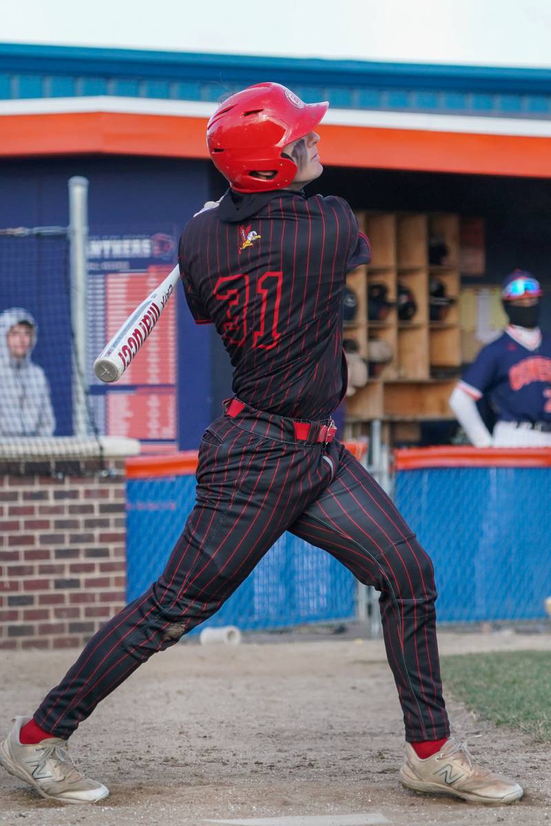 Benet’s Josh Gugora (31) singles against Oswego during a baseball game at Oswego High School on Tuesday, March 25, 2025.