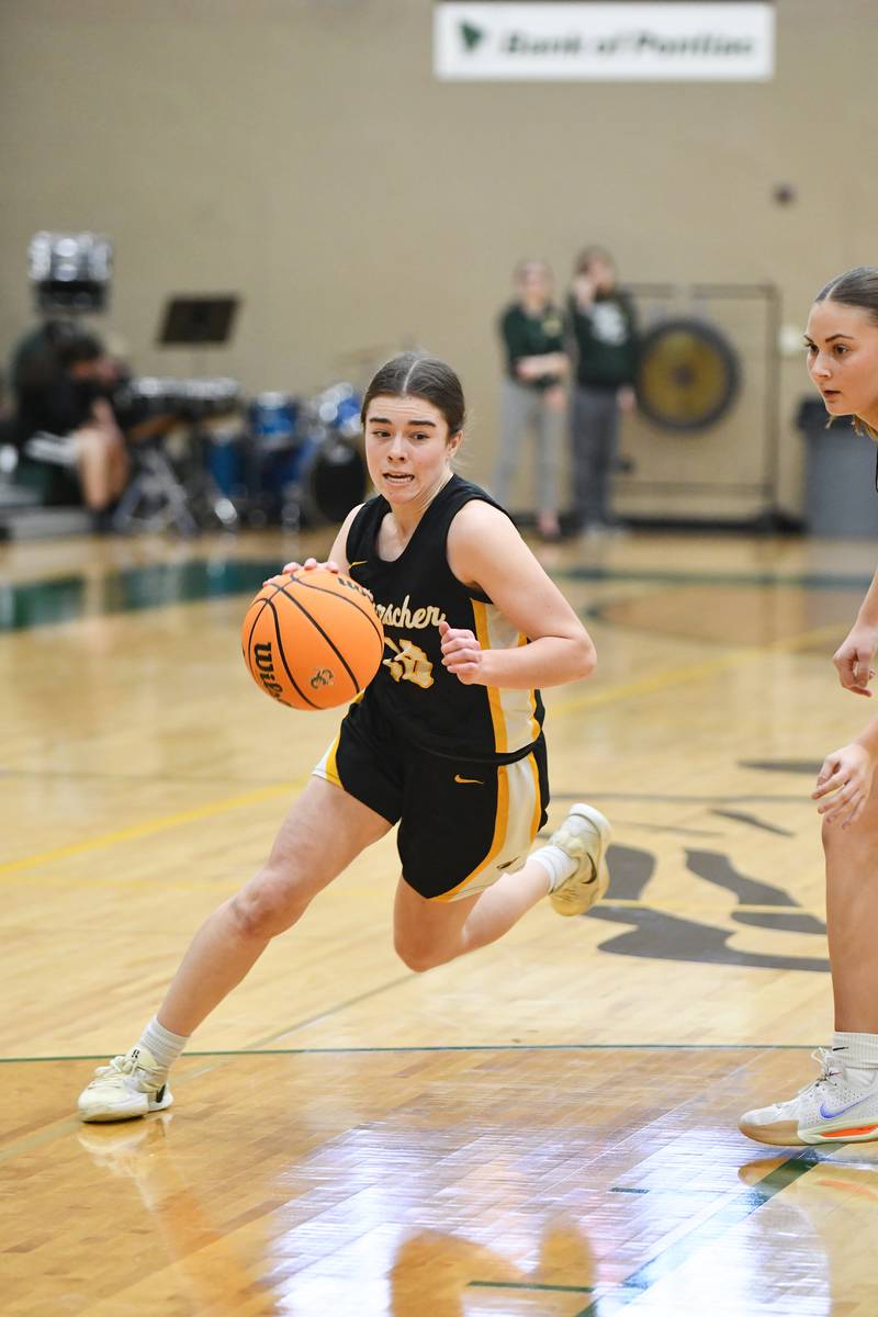 Herscher's Rylyn Adams drives the lane Monday, Feb. 3, 2025, during the Tigers' loss to Coal City at Coal City High School.