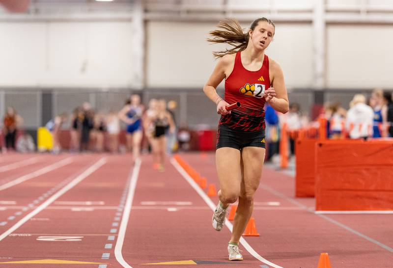 Batavia’s Madison Wnek participates in the 4x800 meter run during the Girls Track and Field DuKane Conference Meet at Batavia High School on Saturday, March 22, 2025.