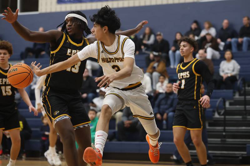 Joliet Catholic’s Danny Cervantes makes backwards pass against Elmwood Park in the Class 3A Joliet Catholic Regional semifinal game on Wednesday, Feb. 25, 2026 in Joliet.