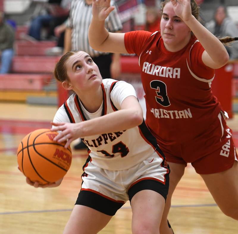 Amboy's Jillian Anderson (14) looks to the basket against Aurora Christian  at the Oregon Girls Tip-Off Tournament on Wednesday, Nov. 19, 2025 in Oregon.