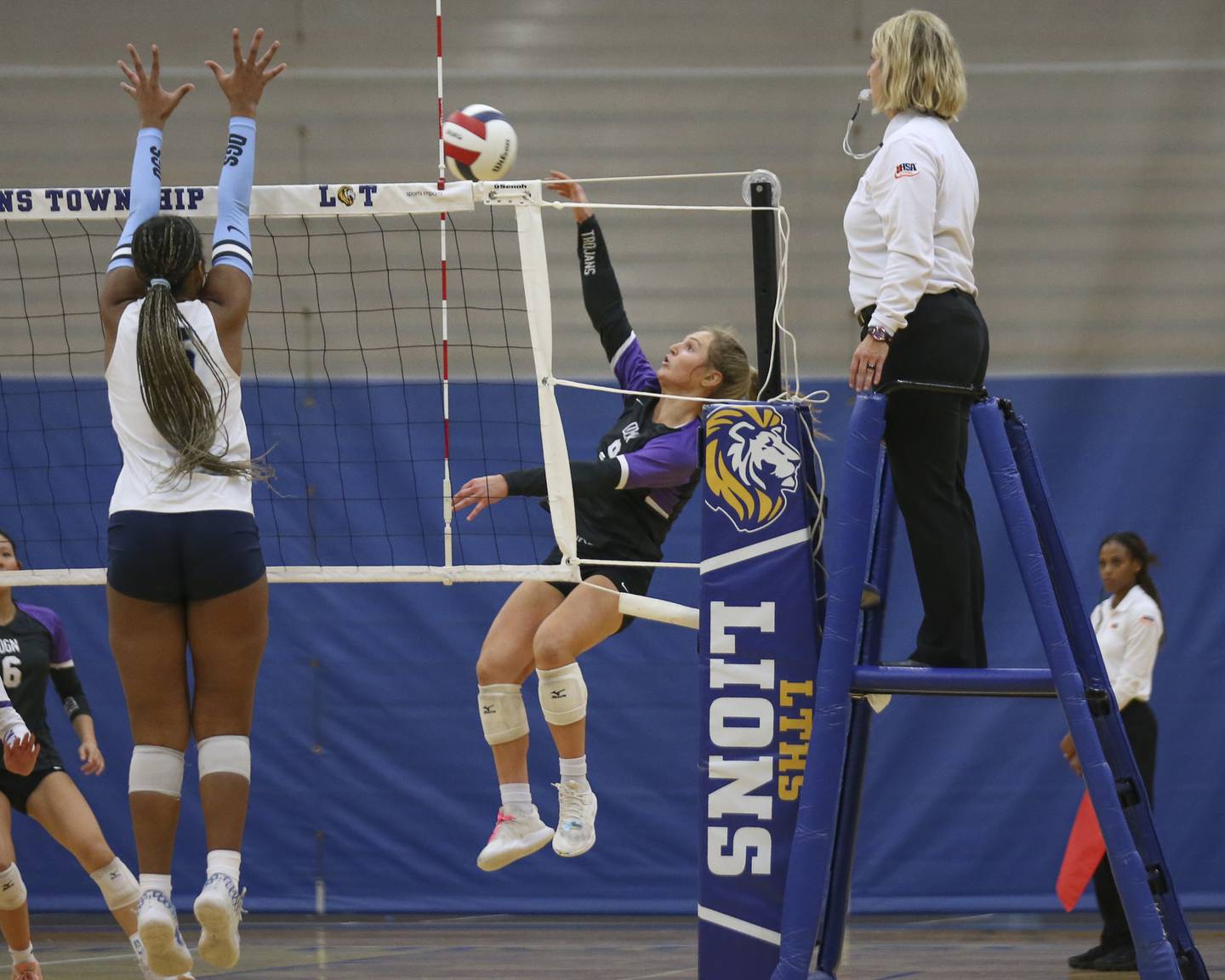 Downers Grove North's Kelley Crowley (9) with a kill attempt during Class 4A Lyons Sectional Semifinal volleyball match between Downers Grove South at Downers Grove North. Nov 4, 2025 in La Grange.