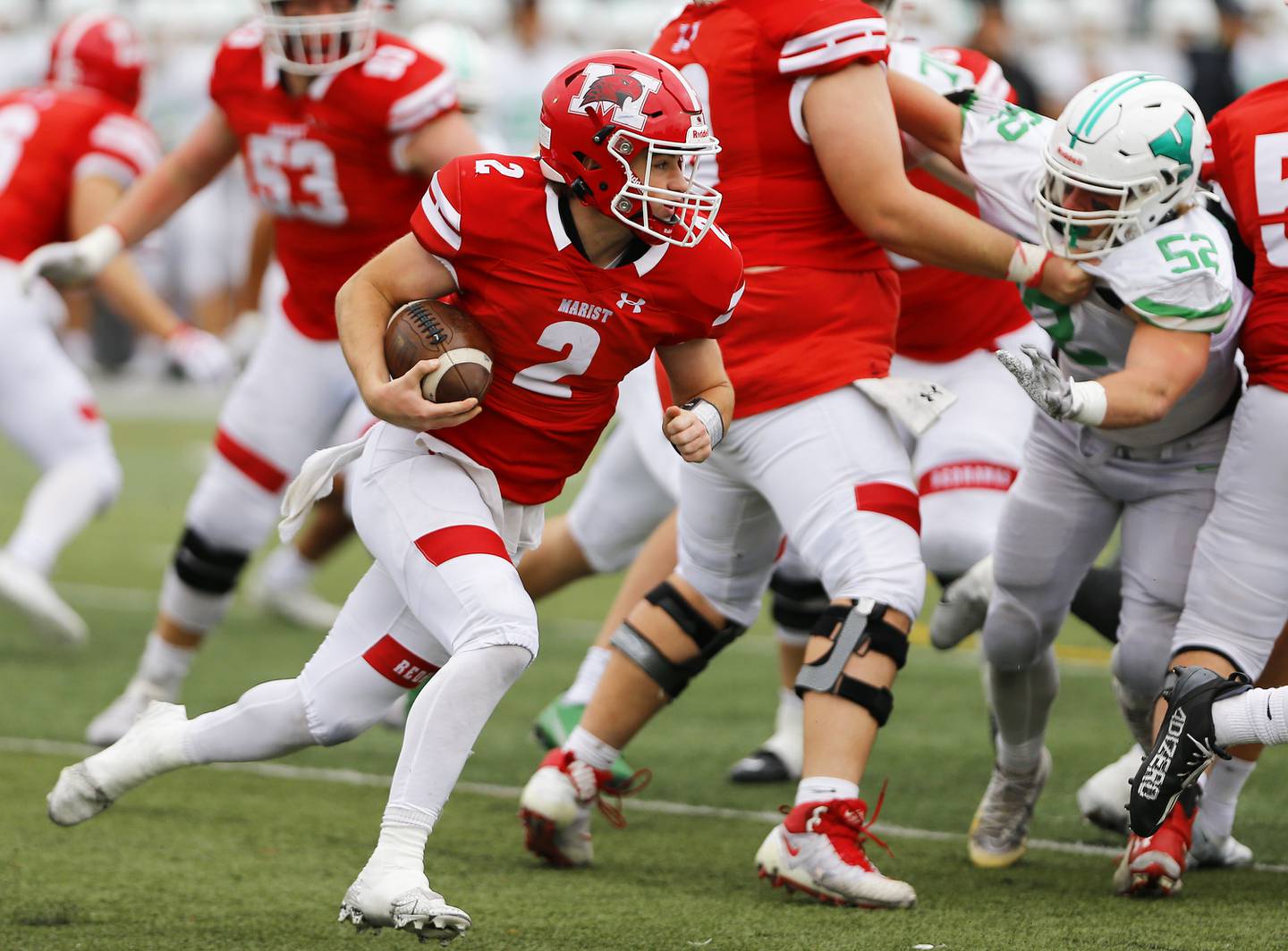 Marist's Dermot Smyth (2) runs the ball during a second round Class 8A varsity football playoff game between York High School and Marist High School on Saturday, Nov. 5, 2022 in Chicago, IL.