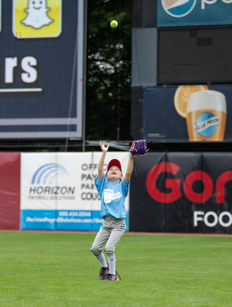 Adalind Organ (6) of West Chicago gets ready to catch a fly ball at the outfield station of the Kane County Cougar's Youth Clinic at Northwestern Medicine Field on Saturday, July 16, 2022.