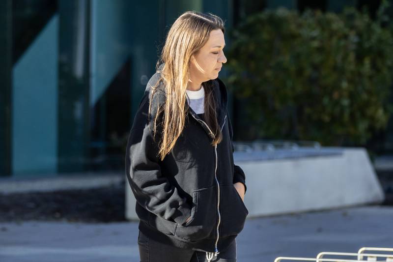 Amy Burgett-Masse, 45, of Elwood, exits the Will County Courthouse in Joliet on Oct. 29, 2025.