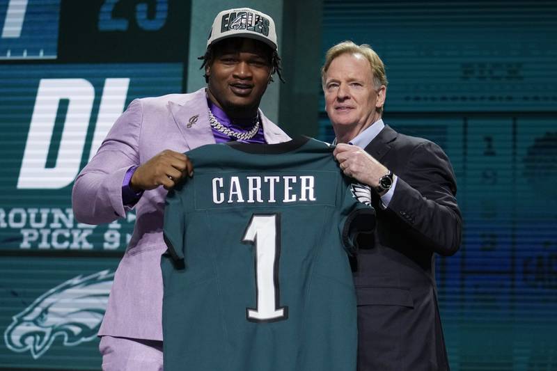 Georgia defensive lineman Jalen Carter poses with NFL Commissioner Roger Goodell after being chosen by the Philadelphia Eagles with the ninth overall pick during the first round of the NFL  draft, Thursday, April 27, 2023, in Kansas City, Mo.