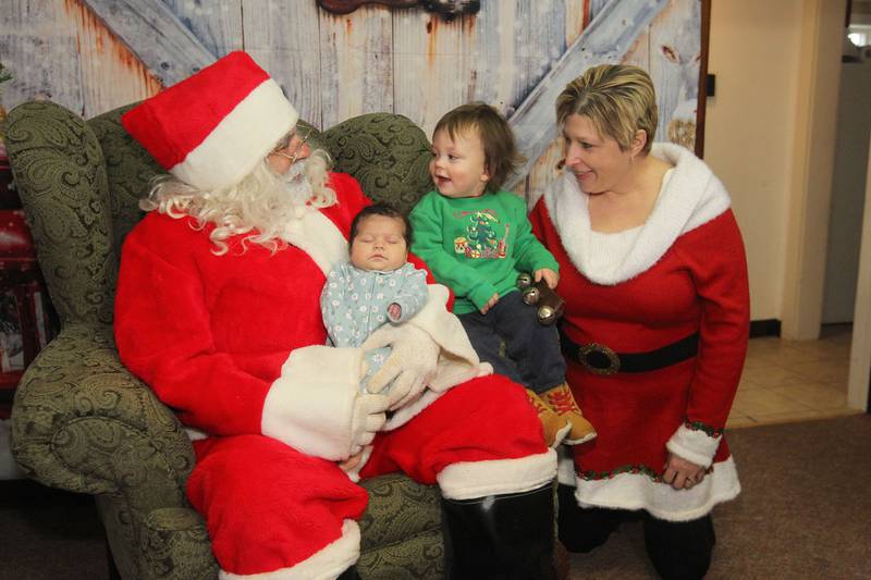 Candace H. Johnson for Shaw Local News Network
Santa visits with Roguelynn Buster,1-month-old, of Antioch, her cousin, Loki B. Buster, nineteen-months-old, of Gurnee and April Soulak-Andrews, of Antioch, president and founder, during The Penny’s Purpose Annual Blanket Drive in Antioch. The Buster family donated a blanket and visited with Santa. (12/17/22)