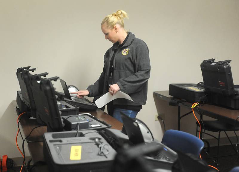 Meghan Honea, an election supervisor with McHenry County, tests and clears history on the voting machines Monday, May 16, 2022, at McHenry County Clerk's Office, 667 Ware Road, in Woodstock, as election judges are trained. Early voting starts for the primary election starts on Thursday, May 19, at the County Clerk's Office.