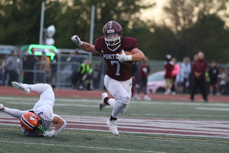 Lockport’s Tyler Pospisil evades the tackle against Naperville North on Friday, Sept. 27, 2024 in Lockport.