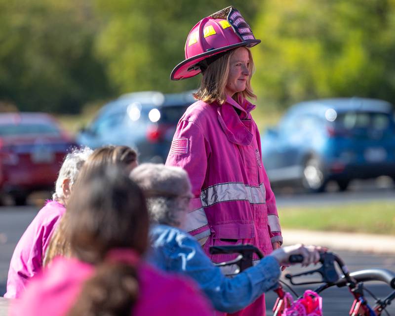 Elizabeth Tribley of the Pink Heals, Rock Falls chapter smiles as resident signs their truck on Wednesday, Oct. 8, 2025 at the LaSalle County Nursing Home in Ottawa.