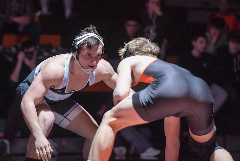 Marian Central's Max Astacio and St. Charles East's Gavin Connolly wrestle at 165 pounds during a match in St. Charles on Wednesday, December 20, 2023.