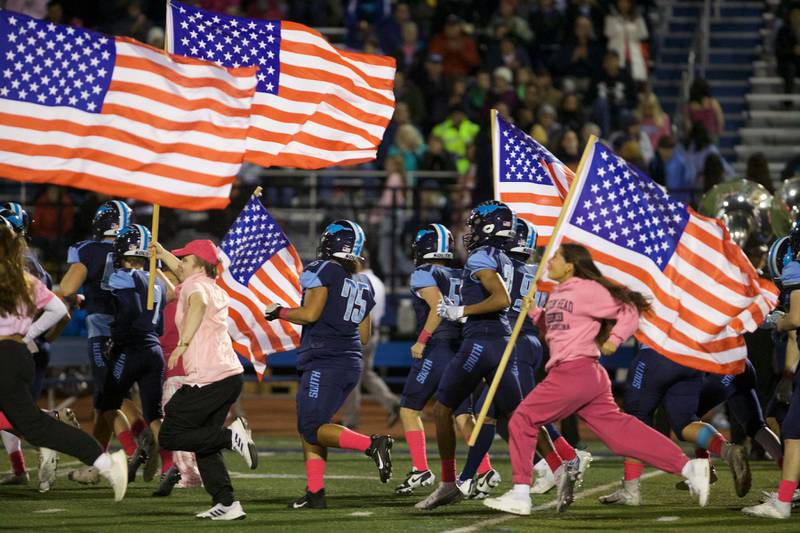 Downers Grove South takes the field against Addison Trail on Friday, Oct.20,2023 in Downers Grove.