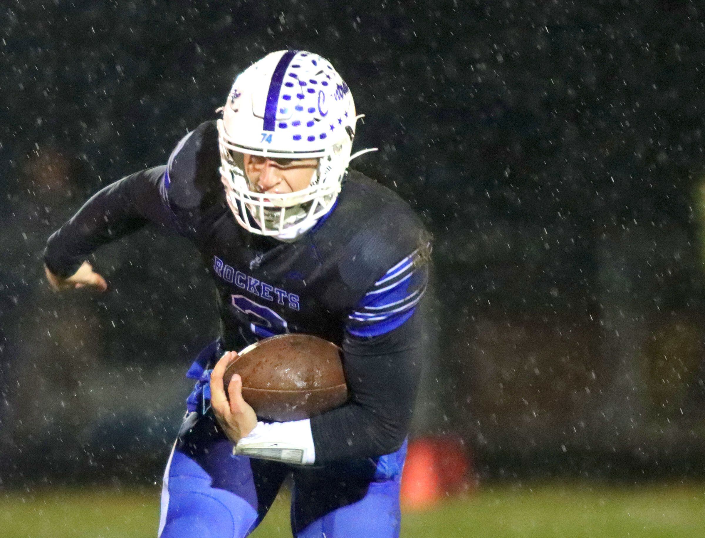 Burlington Central’s Landon Arnold moves the ball against Harlem in IHSA football Class 6A second-round playoff action at Central High School in Burlington on Saturday, November 8, 2025.