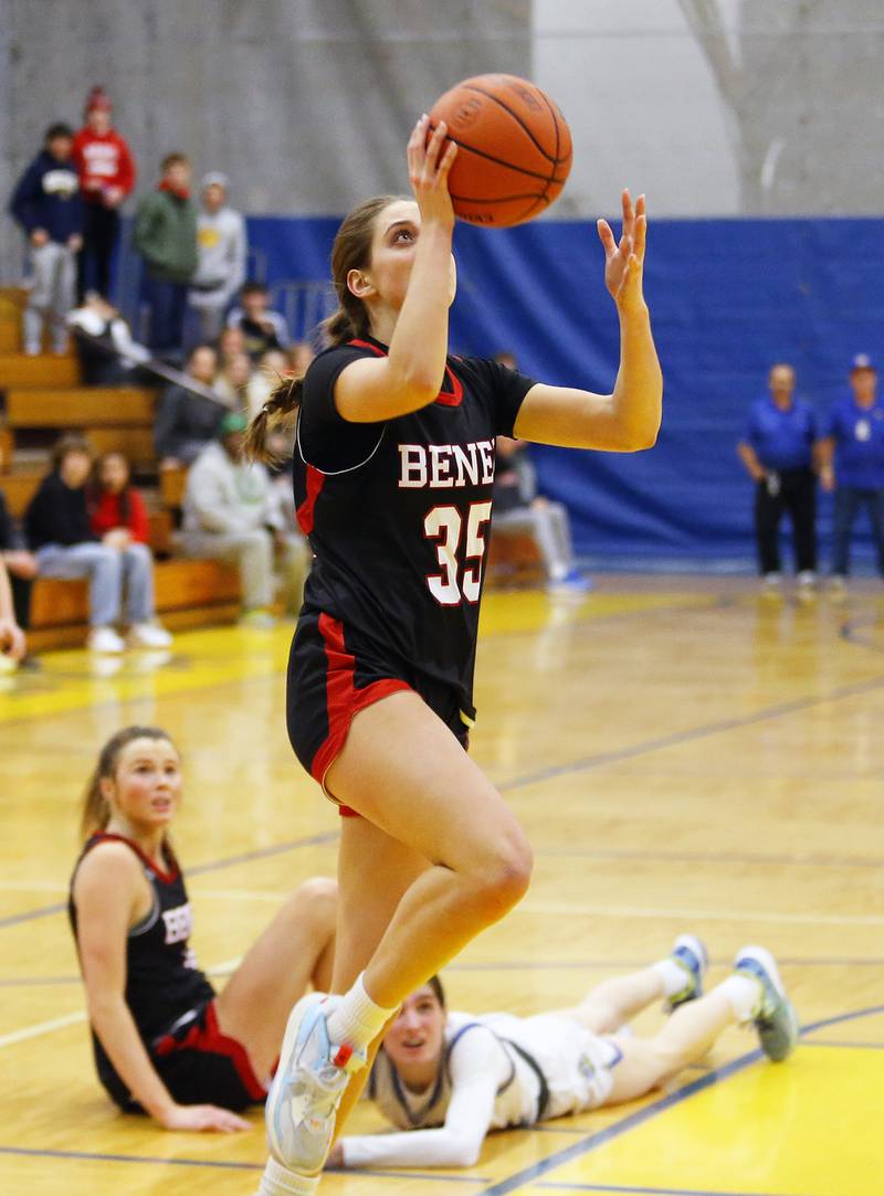 Benet's Emilia Sularski (35) drives to the basket with what proved to be the game winning shot during the girls varsity basketball game between Benet Academy and Lyons Township on Wednesday, Nov. 30, 2022 in LaGrange, IL.