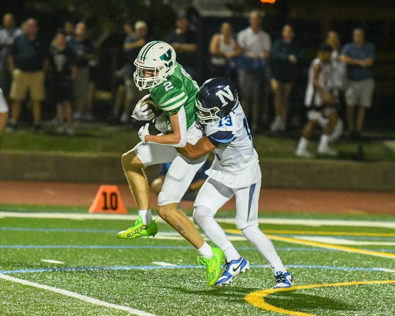 Nazareth Academy Yandiel Colon (13) tackles York’s QB Sean Winton during the second quarter Friday Sep. 1, 2023, in Elmhurst.
