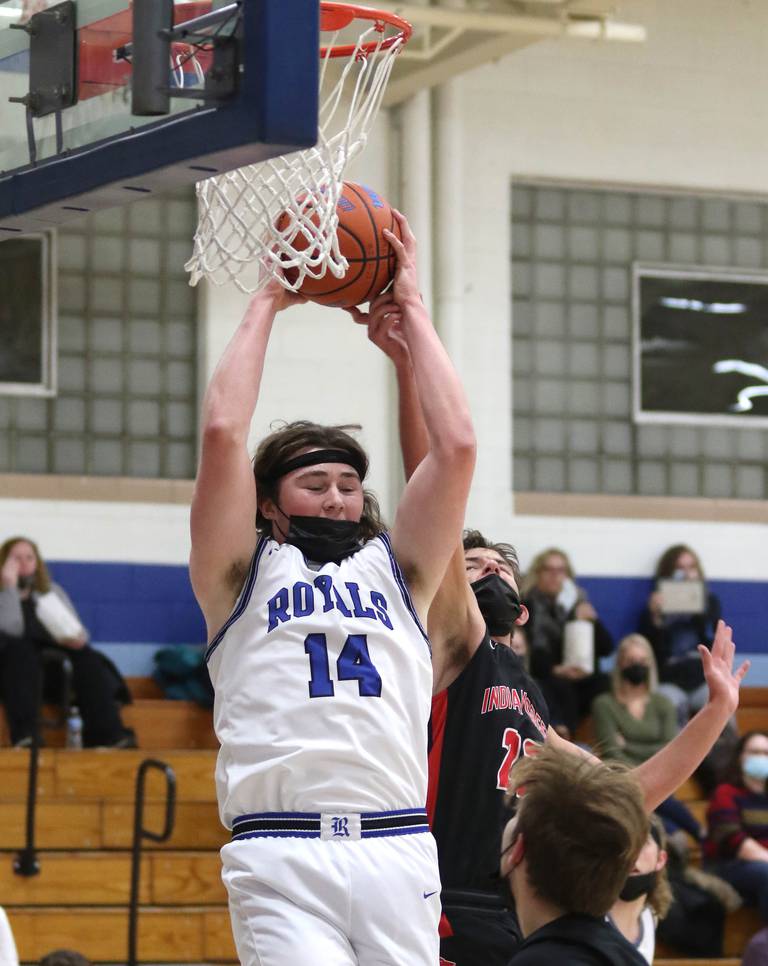 Hinckley-Big Rock's Martin Ledbetter pulls down a rebound in front of Indian Creek's Markus Magden during their game Tuesday, Jan. 18, 2022, at Hinckley-Big Rock High School.