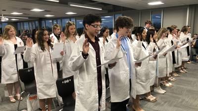 At McHenry High, students earn nursing assistant certifications, white coats