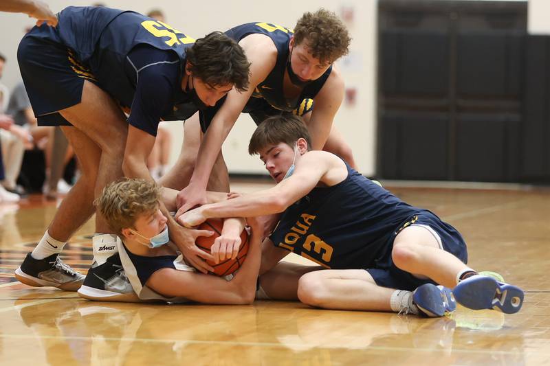 Lemont’s Matas Castillo forces a jump ball fending off a host of Neuqua Valley players in the Warrior Showdown shootout at Lincoln-Way West. Saturday, Jan. 29, 2022 in New Lenox.