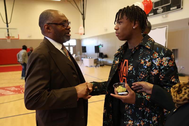 District 5 Councilman Terry Morris (left) greets Jeremy Fears Jr. at the Salvation Army Community Center. Friends and family host a reception for Joliet West’s basketball player Jeremy Fears Jr. before he heads to Houston to play in the All-McDonalds game.