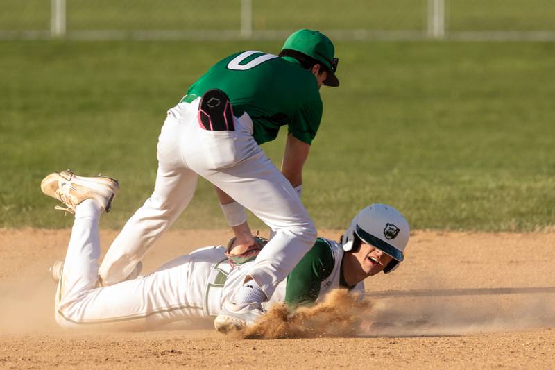 Owen Dunlap (0) of Dwight tags out Gino Ferrari (4) of St. Bede on Tuesday, April 15, 2025 at St. Bede Academy in Peru.