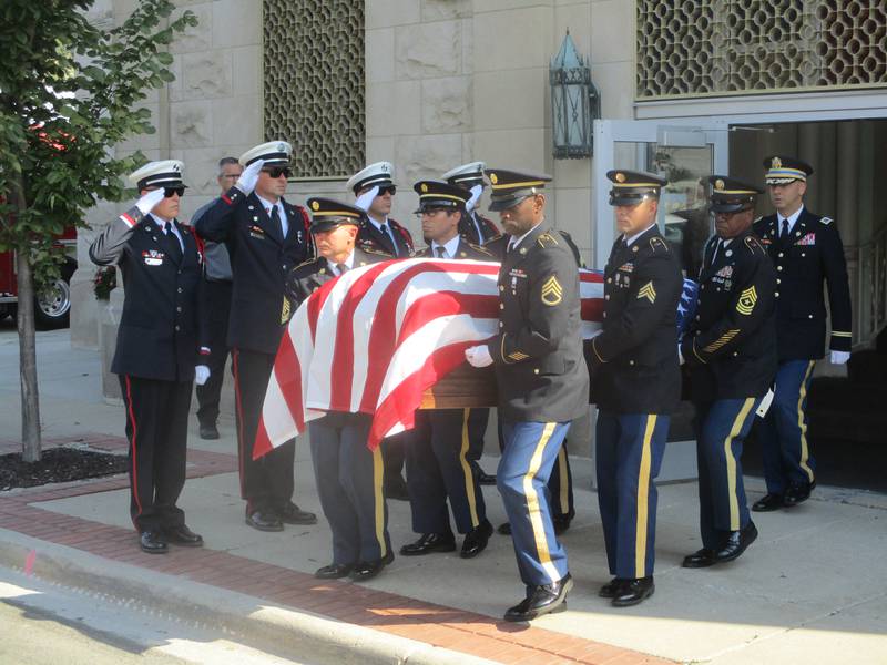 A U.S. Army Funeral Honors Team carries Private First Class Vincent Vega's casket from St. Joseph's Catholic Church after his funeral mass on Friday. Oct. 3, 2025