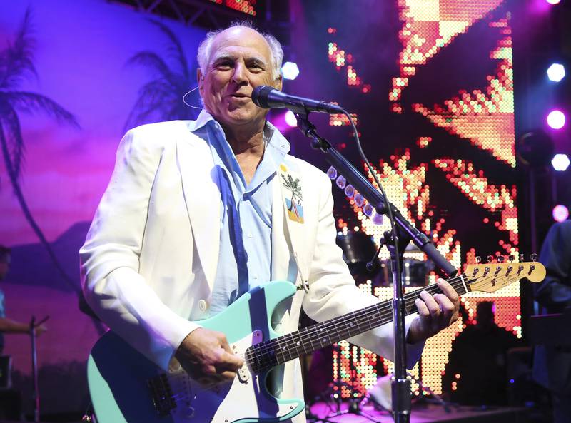 FILE - Jimmy Buffett performs at the after party for the premiere of "Jurassic World" in Los Angeles, on June 9, 2015. “Margaritaville” singer-songwriter Jimmy Buffett has died at age 76. A statement on Buffett's official website and social media pages says the singer died Friday, Sept. 1, 2023 “surrounded by his family, friends, music and dogs”. (Photo by Matt Sayles/Invision/AP, File)