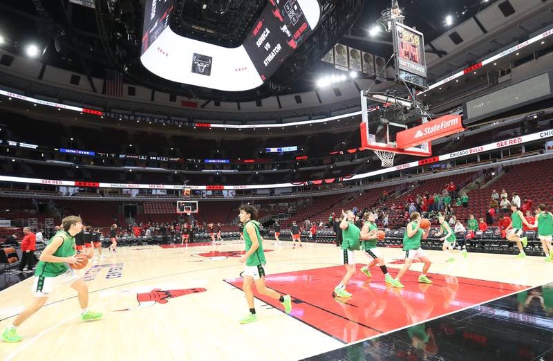 Members of the Seneca boys basketball team warm up against Seneca during a game on Tuesday, Dec. 21, 2023 at the United Center in Chicago.