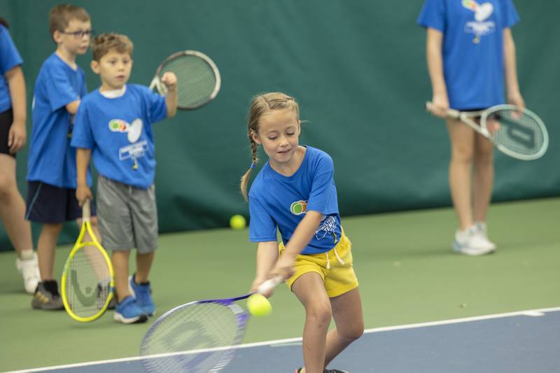 Tennis campers at Westwood practice their forehand shots Thursday, June 29, 2023. The sports facility held a free tennis camp for kids 7-14 to provide participants with a fun introduction to the sport. Players learned skills and other aspects of the game and were also presented with a t-shirt and a goodie bag.Thursday, June 29, 2023.