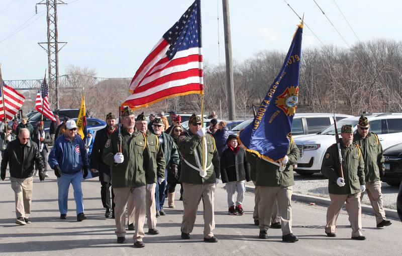Veterans march during the annual Pearl Harbor parade and memorial service on Saturday in Peru. This year marks the 83rd anniversary of the Dec. 7, 1941, attack on Pearl Harbor.
