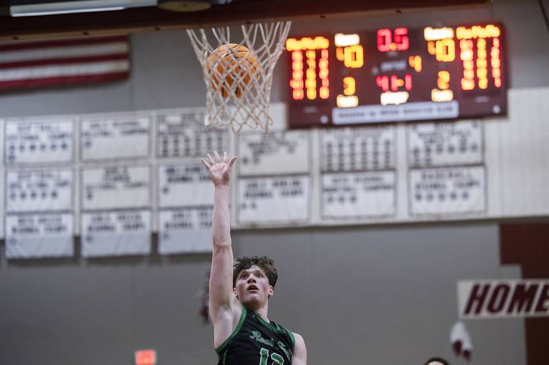 Rock Falls’ Ryken Howard puts in a break-a-way shot with less than a second to go to propel the Rockets to a 42-40 win over Winnebago Tuesday, March 4, 2025, during the 2A boys basketball Sectional final at Marengo.