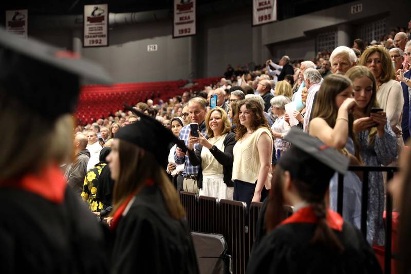 Parents watch as their graduates enter the arena during the Batavia High School 2023 commencement ceremony at Northern Illinois University in DeKalb on Wednesday, May 24, 2023.