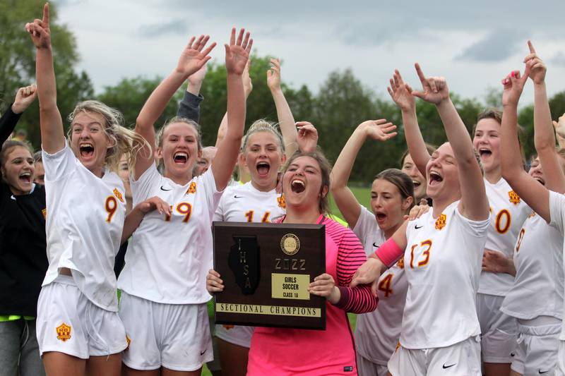 Richmond-Burton celebrates a win over DePaul Prep in sectional title game action at Marian Central in Woodstock Friday evening.