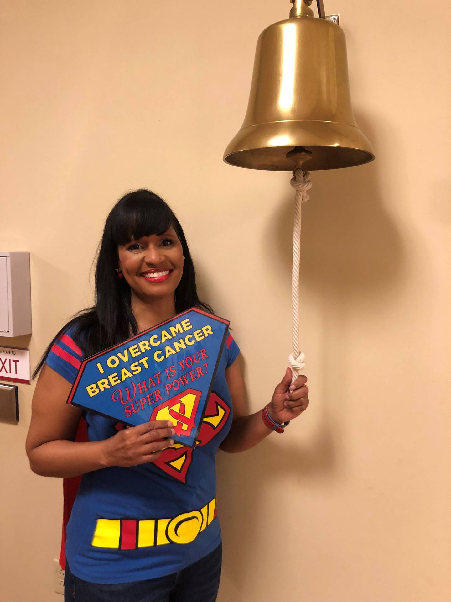 Ericka Glorious Moore of Tinley Park wore a Superman shirt and cape for her final radiation treatment at the UChicago Medicine Comprehensive Cancer Center at Silver Cross Hospital on Friday, May 13, 2022, Moore rang the bell to symbolize the end of her cancer journey.