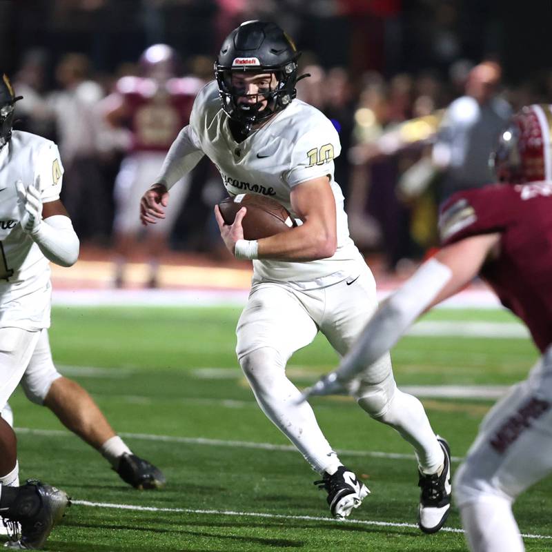 Sycamore's Burke Gautcher breaks through the Morris defense for a touchdown during their game Friday, Oct. 20, 2023, at Morris High School.