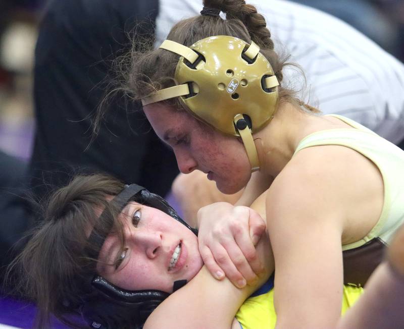 Jacobs’ Julia Felton, top, controls Wheaton North’s Mei Schmadeke at 110 pounds in Whip-Pur Women’s Classic varsity girls wrestling on Saturday, Dec. 20, 2025, at Hampshire High School in Hampshire.