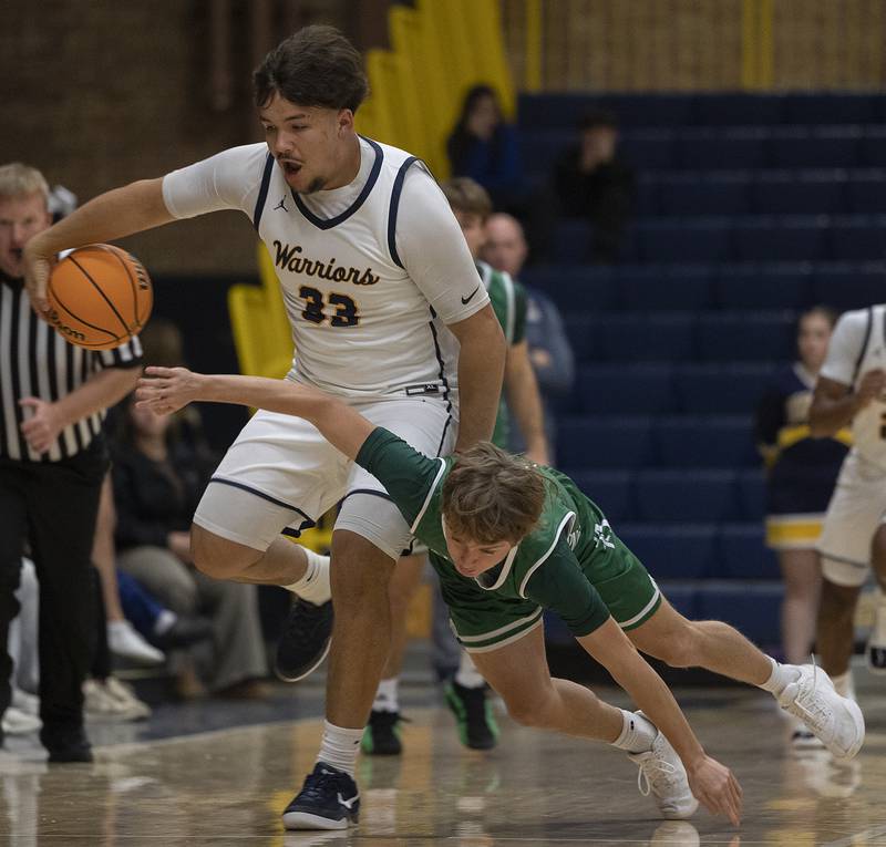 Sterling’s Maddux Osborn works against Alleman’s Adam Van Meighem Friday, Dec. 20, 2024, at Sterling High School.