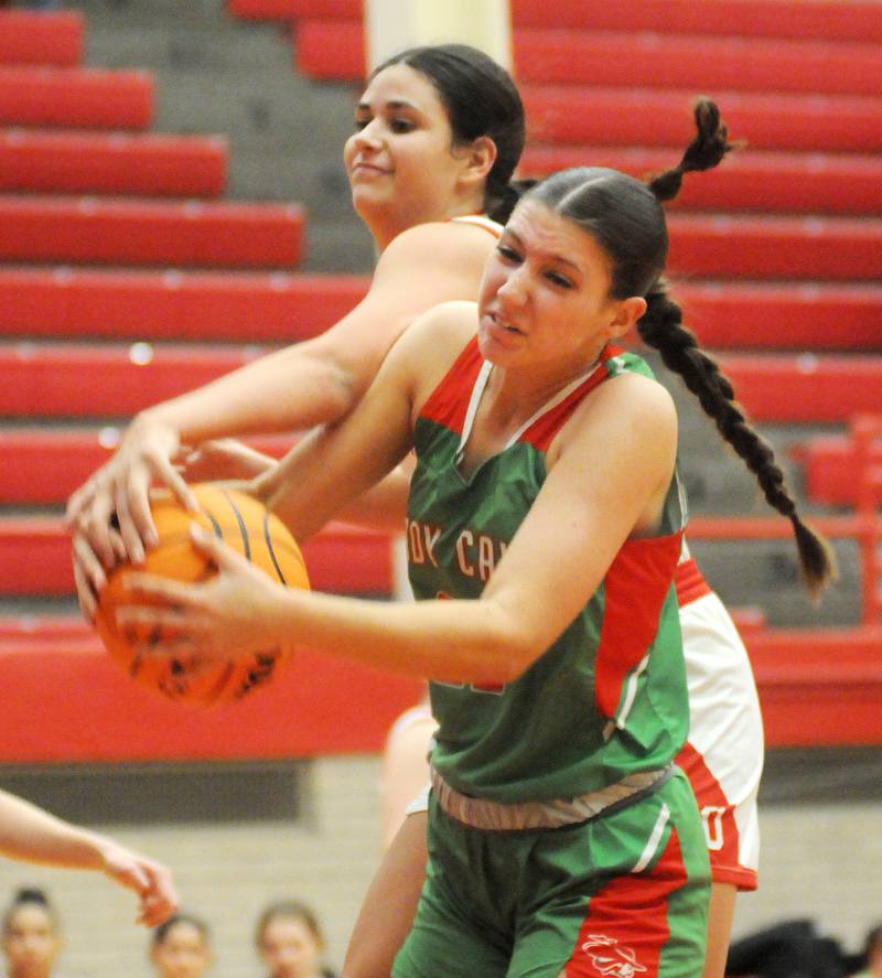 Ottawa's Bella Knoll fights for a rebound with La Salle-Peru's Brianna Ruppert on Friday, Dec. 13, 2024, at Kingman Gym.